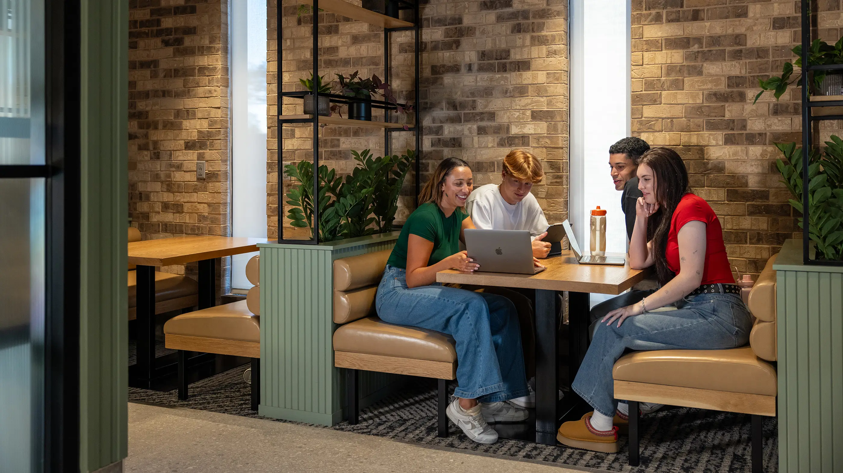 a group of young adults studying