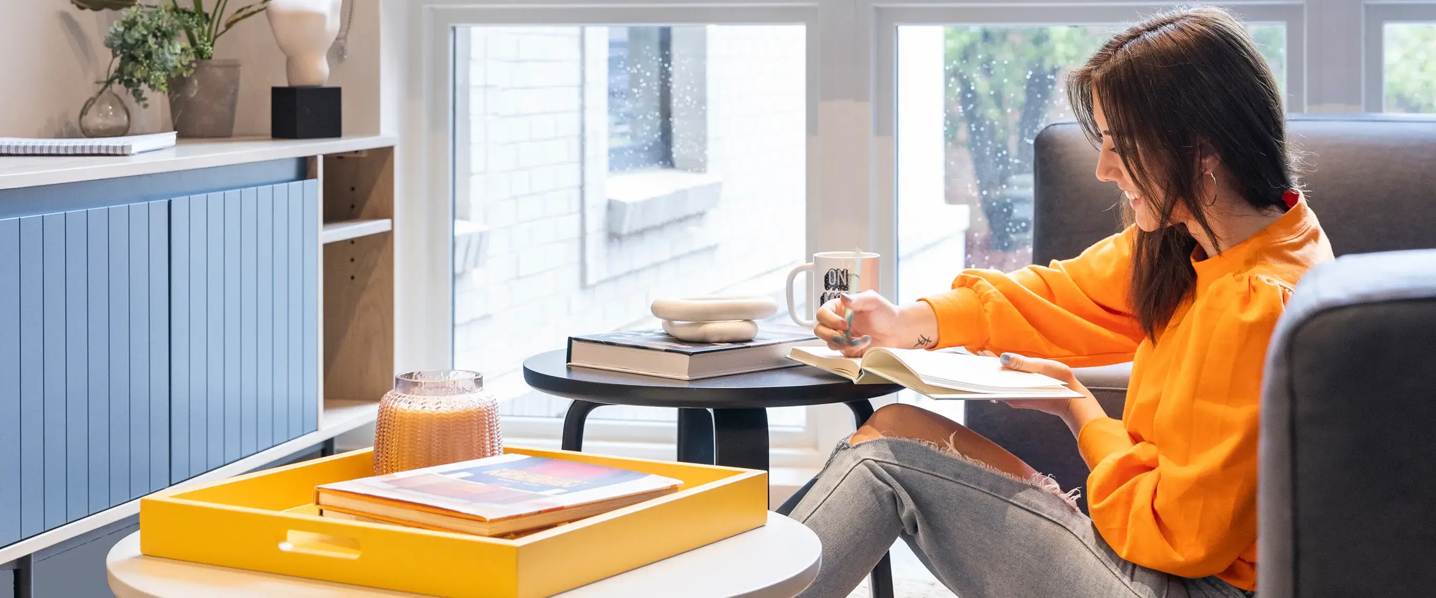 a woman sitting and reading